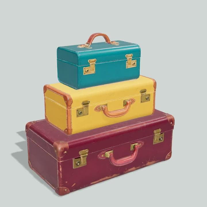 A 3D model of three stacked vintage suitcases in teal, mustard and oxblood, turning on a stand