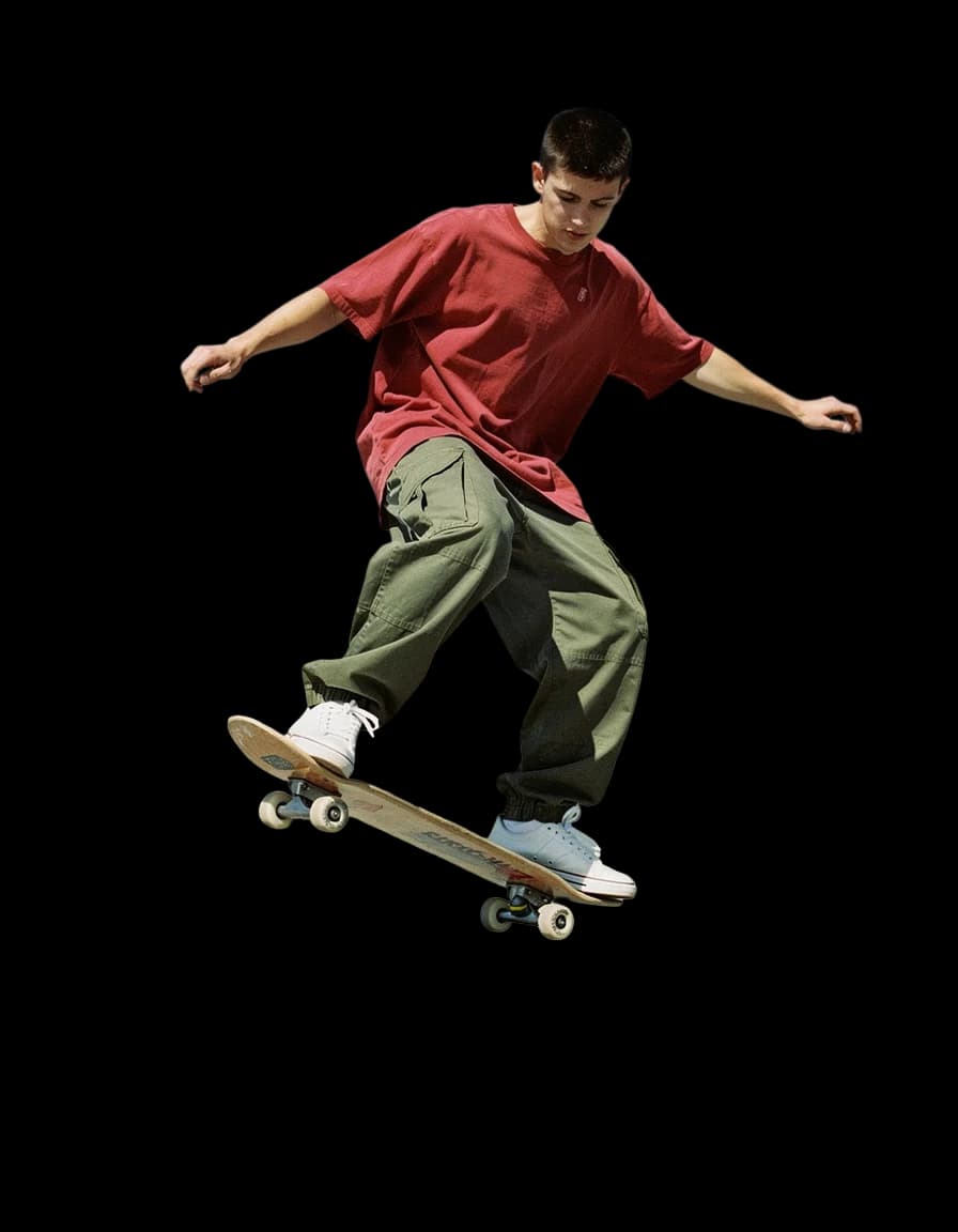 A skater mid-trick, the park gone, a real run on Leap