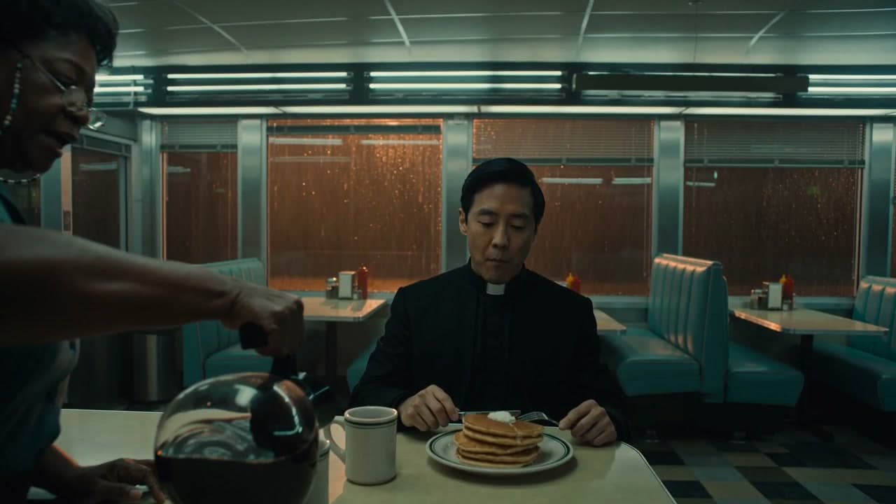 3 a.m. at the diner, and the priest keeps eating, a real run on Leap