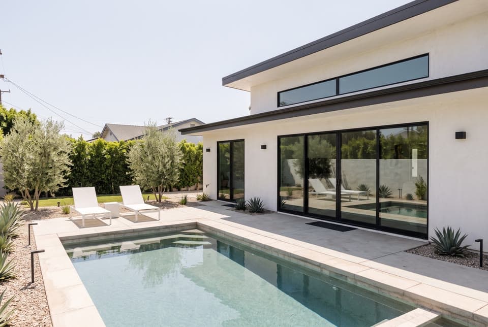 The photo a pool house at blue hour started from