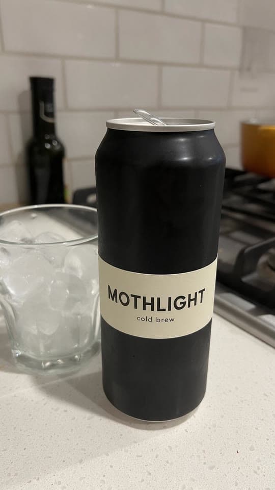 The photo cold brew, deadpan in a parked car started from